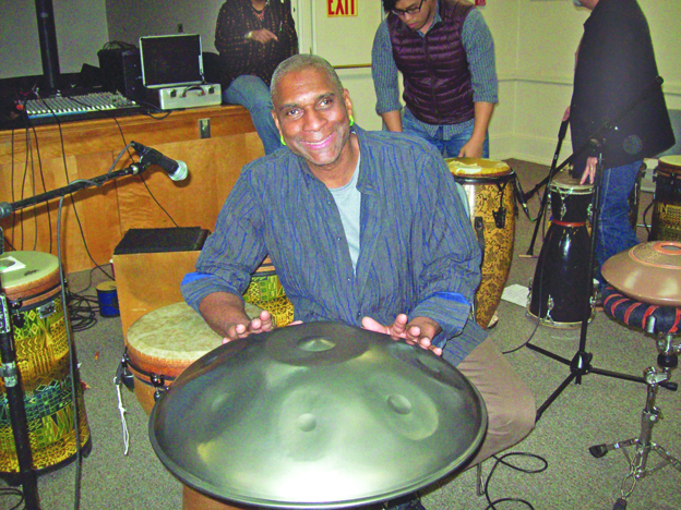 Acclaimed multicultural percussionist, Jeff Haynes, sits behind a Hang Drum, one of several types of drums he played Saturday at the Poughkeepsie Public Library. Haynes, a City of Beacon resident, along with a guest musician, Sean Harkness, and other music guests, entertained the crowd for an hour with a rhythmic journey titled, 
