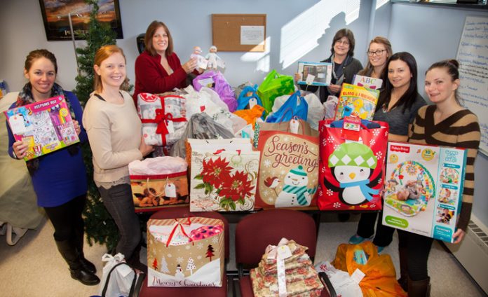 Nursing Club Members with holiday gifts ready to deliver to needy families. Pictured from left to right: From Left to Right- Michelle Van Wagenen, Kristin Auchmoody, Jackie McDowell, Nursing Dept. Chair Jody Mesches, Maura Steyer, Sarah Perry, and Christie Shultis.