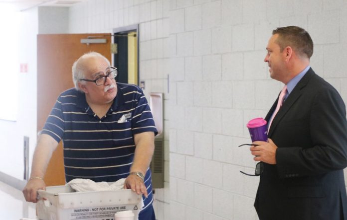 Orange County Executive Steven M. Neuhaus (right) talks with Michael Russo of Middletown at the 20th annual Senior Forum.