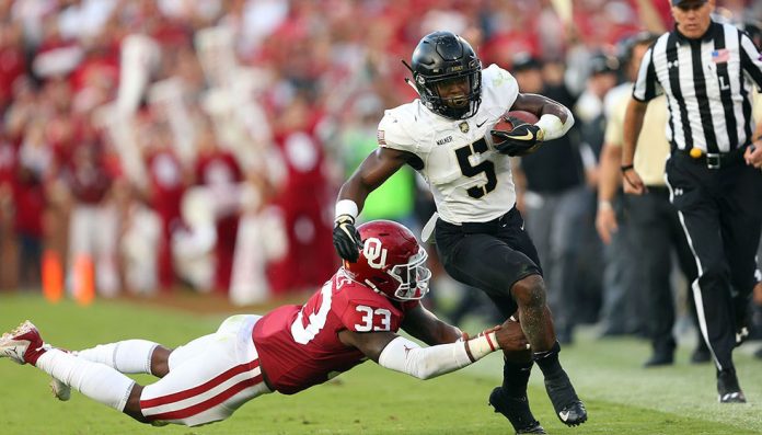 The Black Knights came to play at fifth-ranked Oklahoma on Saturday night, forcing overtime, but the Sooners escaped with the 28-21 victory . Army Black Knights Kell Walker (5) finished with a season best 80 yards on the ground. Photo: Danny Wild