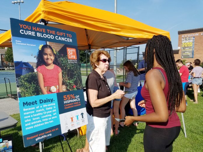 At a recent swabbing drive at Mt. St. Mary College Deborah Pariser, of Newburgh, advised a student about the opportunity to save a life one day by joining the marrow registry.
