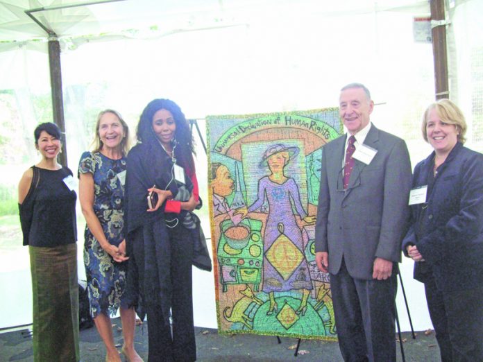 Recipients being honored at Eleanor Roosevelt Center Val-Kill Medal Ceremony (Loung Ung, Dr. Pamela Edington, Jaha Dukureh, The Honorable Albert M. Rosenblatt, and Roberta (Robbie) Kaplan) stand alongside the quilt, “Expressions in Equality,” made in honor of the 70th Anniversary of the Universal Declaration of Human Rights. Not pictured is recipient Tarana Burke.