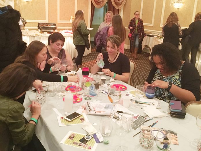 Women painted glasses at “What Women Want” with Created With Love Boutique.