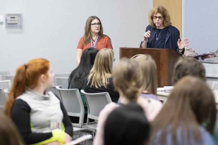 Event facilitators Sonya Abbye-Taylor, Mount assistant professor of Education (right) and Beverly Browne Fazio ’94 MSE ‘97, consultant with the Newburgh Enlarged City School District (left) introduced students to the Poverty Simulation Experience at the college.