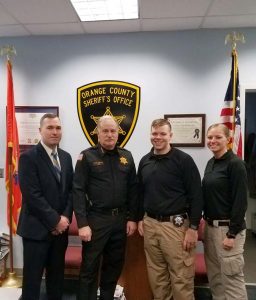 From Left to Right: Sr. Inv. Tim Riordan, Sheriff Carl DuBois, Inv. Joe Morales, and Inv. Kelsey McDonough pose for a photo.