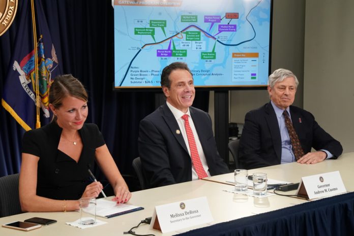 Governor Cuomo, center, holds a press briefing on his meeting with President Trump to discuss infrastructure priorities, including the Gateway Tunnel. Melissa DeRosa, Secretary to the Governor and Richard Cotton, head of the Port Authority joined Cuomo.