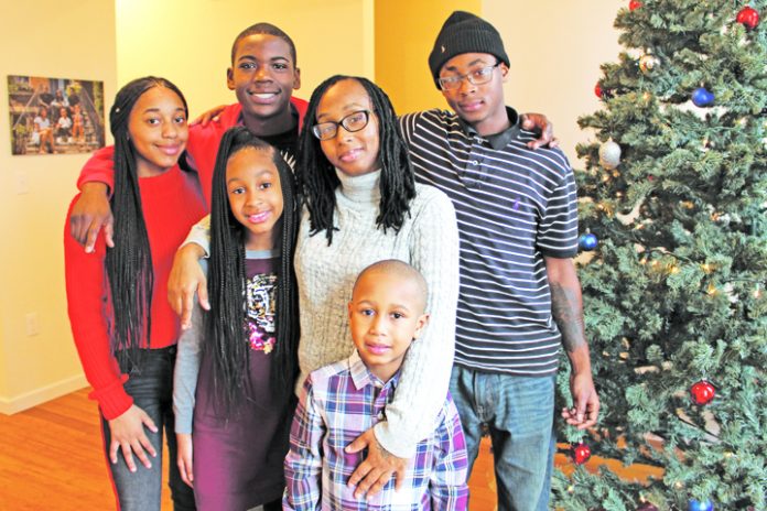On Saturday afternoon, Lakisha Atkins and her family officially became Habitat for Humanity of Greater Newburgh homeowners. Their 25 Johnson Street residence is the culmination of a long, dedicated journey, filled with support, love and inspiration, along with the lumber of the 2017 Rockefeller Center Christmas Tree, adding to the specialness of the day during this holiday season.