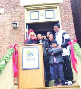 On Saturday afternoon, Lakisha Atkins and her family officially became Habitat for Humanity of Greater Newburgh homeowners. Their 25 Johnson Street residence is the culmination of a long, dedicated journey, filled with support, love and inspiration, along with the lumber of the 2017 Rockefeller Center Christmas Tree, adding to the specialness of the day during this holiday season.