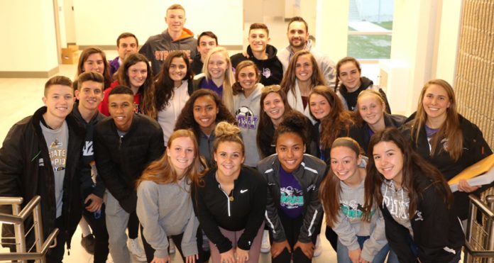 Members of the Monroe-Woodbury boys and girls soccer teams pose for a picture at the Government Center on Thursday, December 6th after being recognized by the Legislature and Orange County Executive Steven M. Neuhaus. Included in the picture are Monroe-Woodbury boys soccer assistant coach Marc Gawron, boys coach Kenny Clearwater and assistant girls coach Kate Santoianni.
