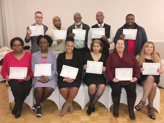 Project L.I.F.E. staff pose with their certificates at their their 1st Annual Christmas Recognition Banquet.