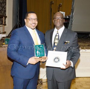 Torrance Harvey receives the Trowell-Harris Award from Glendon Fraser during the 21st Annual Tuition Assistance Awards Celebration of the Major General Irene Trowell-Harris Chapter of the Tuskegee Airmen on Saturday, February 2, 2019 at Anthony's Pier 9 in New Windsor, NY. Hudson Valley Press/CHUCK STEWART, JR.