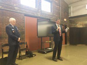Assistant Secretary of the Air Force, John Henderson, speaks to the community about the status of the water contamination issue and where they are at in the process of remediating the water supply Thursday night at the Newburgh Unity Center. Air Force Lieutenant General, Scott Rice, looks on.