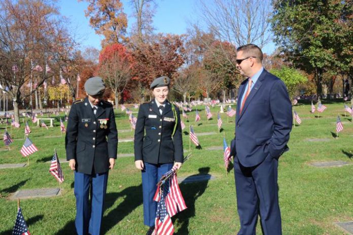 Pictured with Orange County Executive Steven M. Neuhaus are (from left to right) Minisink Valley High JROTC students Elena Cruz, a senior, and junior Lexie Toller at last year’s Memorial Day event at the County’s Veterans Memorial Cemetery.