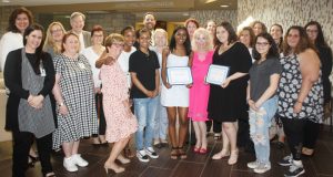Members of the St. Luke’s Cornwall Health System Foundation, Auxiliary, and hospital leadership join scholarship recipients Nina Zylberberg and Ariana Woodruff.
