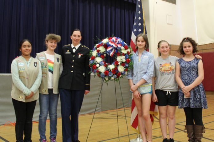 Grade 6 students join SPC Gretchen Wagner during the May 20 Grade 6 Memorial Day Ceremony at New Paltz Middle School.