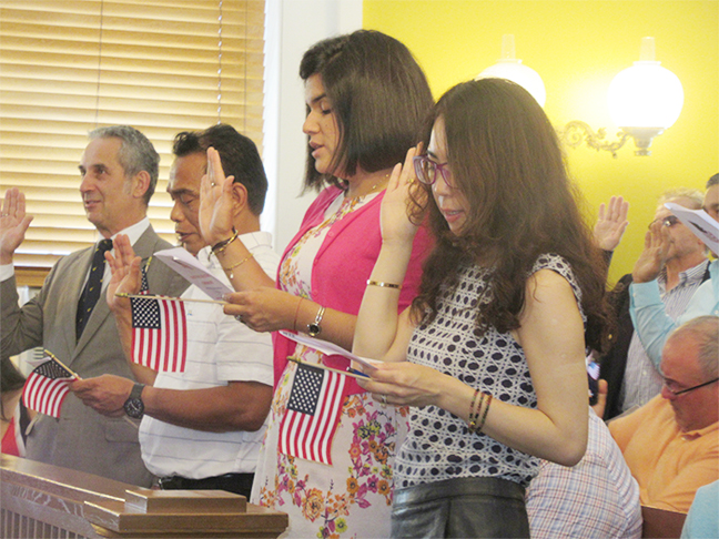 Forty-four of America’s newest citizens recited their oath of allegiance to the United States and received a rousing ovation at the historic Putnam Courthouse.