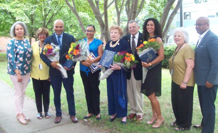 Five Newburgh community members were honored at last Wednesday’s “Ring the Bell” Celebration, kicking off the new school year at the Newburgh Enlarged City School District. Pictured are the five honorees along with some of their family members and Newburgh Enlarged City School District Board of Education members.