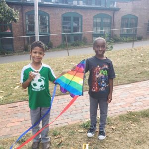 Friends Cassius Vasquez, age 8 and Kaiyon Gayle, age 7 of the City of Newburgh, show off the colorful kite that they propelled into the air as they ran around having fun at Washington’s Headquarters lawn Saturday afternoon.