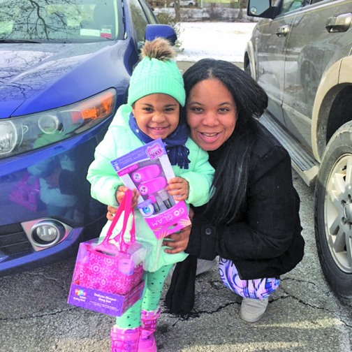 Rayne Rhodes, age three from the City of Beacon, came to the Prince Hall Hebron Lodge Annual Holiday Party Saturday with her mom, Cecilia Smutney, where she selected the gift of her choice, a diaper set for her baby doll. Her mom also brought home presents for her other daughter who got a nail set as well as a soccer ball for her son.