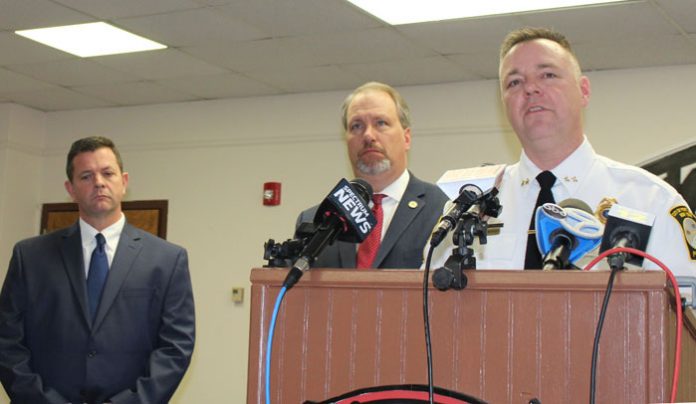 Port Jervis Police Chief William Worden discusses details of the case while Mayor Kelly Decker, left, and District Attorney David Hoovler, listen.