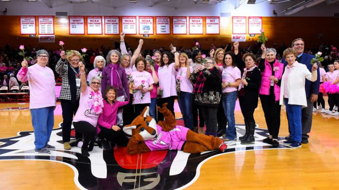 At halftime, Marist Athletics continued its annual halftime survivor salute, with over 20 breast cancer survivors receiving recognition for their courage.
