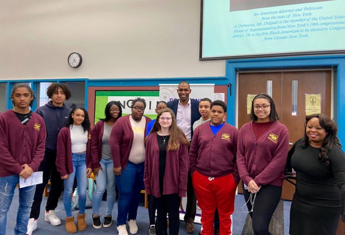 United States Representative Antonio Delgado poses with Ellenville High School students following a Black History Month workshop on February 20.