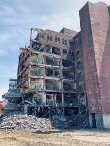 At the $300 million Hudson Heritage mixed-use community on Route 9 in the Town of Poughkeepsie, work is under way to demolish structurally unsound buildings like the Clarence O. Cheney.