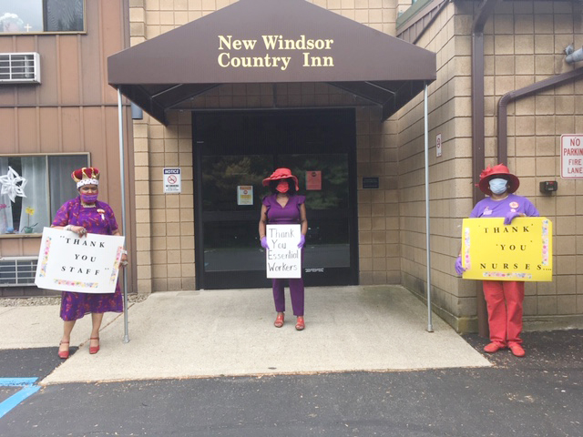 Three “Queens,” representing some of the chapters of the Red Hat Society who came out to the New Windsor Country Inn nursing home in New Windsor Friday afternoon, show their love and gratitude for the essential workers. Pictured above from left are; Terrencia A. Brown of the Ladies of Distinction, Rinnay Carney-Koutovan of The Sophisticated Rubies, and Valerie Ruffin of Soulful Sisters.