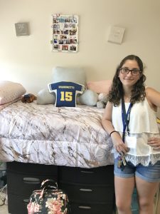 Kylie Dragonetti of Massapequa, N.Y., a first-year Nursing major, is excited to begin her college career at Mount Saint Mary College. She is seen here in her room. This semester, students are allowed to take off their masks in their own rooms, but must wear face coverings in all other public places on campus. Photo: Lee Ferris