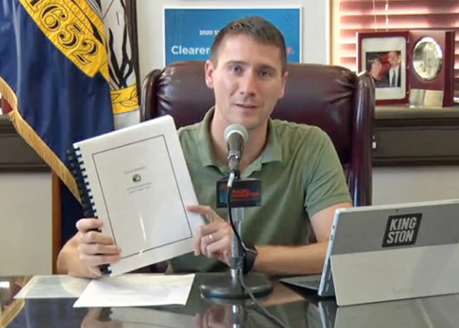 Mayor Steven Noble holds a copy of his proposed 2021 Kington City budget.