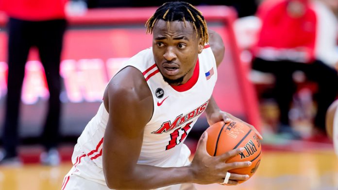 The Marist men’s basketball team completed a weekend sweep of Metro Atlantic Athletic Conference rival Manhattan on Sunday with a 72-67 overtime triumph at Draddy Gymnasium. Pictured above, Victor Enoh set career highs for points (11) and rebounds (15).