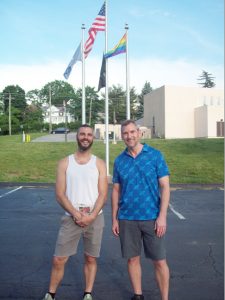 David Rosenberger, on left and his partner Gary Perez stand in front of the Pride Flag outside of Beacon’s City Hall. The symbolic flag will be displayed throughout the month of June, Pride Month, celebrating the LGBTQ+ community.