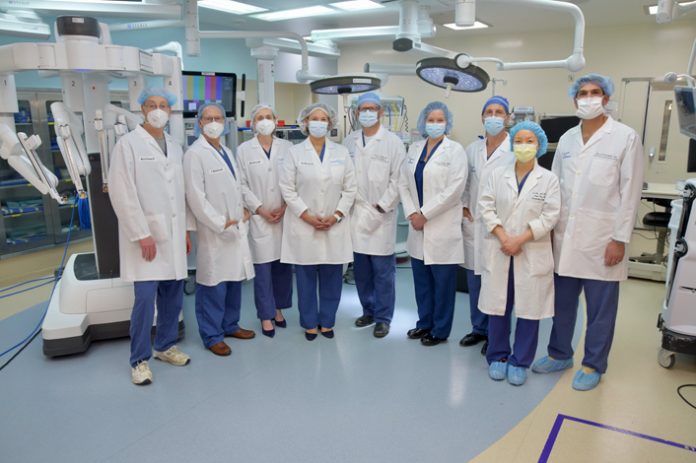 Surgeons in Northern Westchester Hospital’s Robotics Program (from L-R) Warren D. Bromberg, MD, FACS, urology, director of the Institute of Robotic and Minimally Invasive Surgery; Michael Shaw, MD, obstetrics and gynecology; Maud Lemercier, MD, general surgery; Amanda Messina, MD, general surgery; Darren I. Rohan, MD, thoracic surgery; Doreen Sicotte, FNP, Supervisor, Advanced Clinical Providers; Bruce Molinelli, MD, general surgery; Sue Zhou, MD, urogynecology; and Navid Mootabar, MD, obstetrics and gynecology pose for a photo. Photo John Vecchiolla