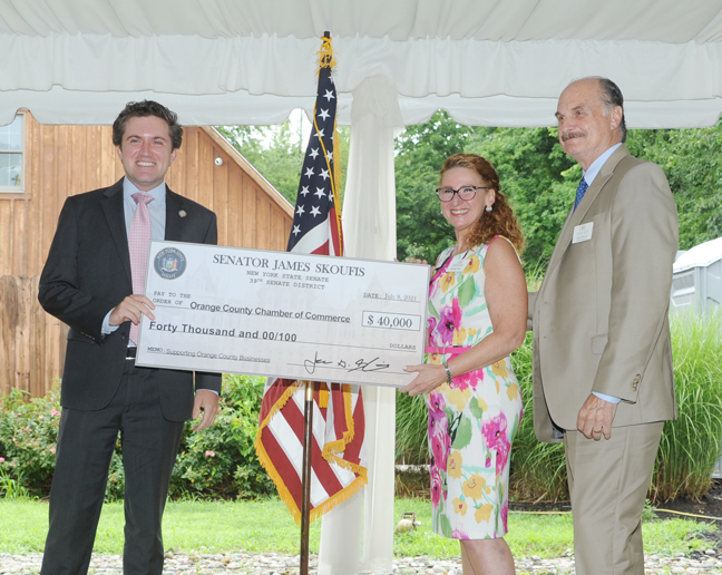 New York State Senator James Skoufis presents a check to Heather Bell, Chamber President & CEO and Marcel Martino, Chamber Board Chair at the Chamber’s July 8 Membership Breakfast. Photo: Visual Concepts Photography
