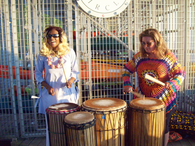 From left are Beacon Drum Circle’s Stephanie Tuck along with another member as they entertain guests at Beacon’s Long Dock Thursday evening. The popular Drum Circle will continue to take place each Thursday, from 6-8pm, through the month of August at the scenic Long Dock locale.