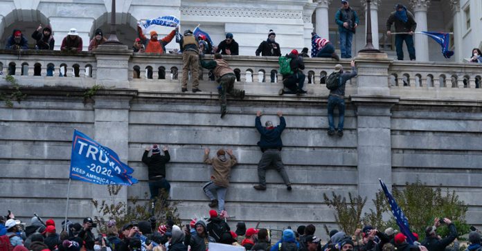 A photo of the riot that took place when Trump supporters stormed the capital building.
