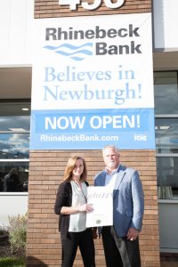 Emma Fuentes of NYS Senator James Skoufis office presents Rhinebeck Bank President and CEO Micahel J. Quinn with a certificate during the grand opening of the Newburgh branch on Wednesday, September 29, 2021. HUDSON VALLEY PRESS/ Chuck Stewart, Jr.