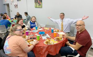 Dr. Jason N. Adsit, president of the Mount (center) joins the fun at LSU’s recent Hispanic Heritage Month celebration.