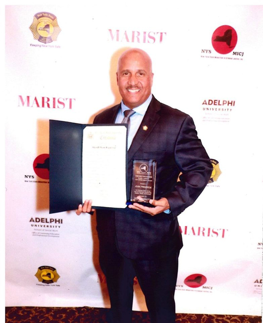 New York State Minorities in Criminal Justice (NYSMICJ) presented the Harry Corbitt award to Ulster County Sheriff Juan Figueroa.