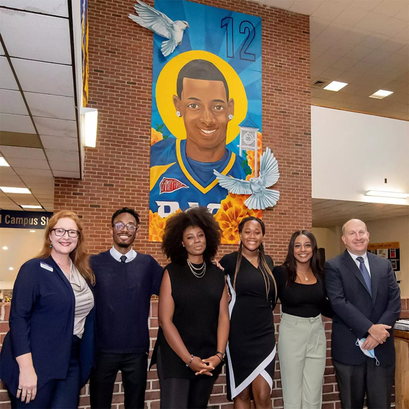 Pace University unveiled a mural in the Kessel Student Center to commemorate the memory of Danroy “DJ” Henry Jr. Pictured above Dean of Students Rachel Carpenter, Ja’Rette Mungin, Muralist Brittney Price, Irach’e “Shea” Teague, Kimberly Mars, and Pace President Marvin Krislov.