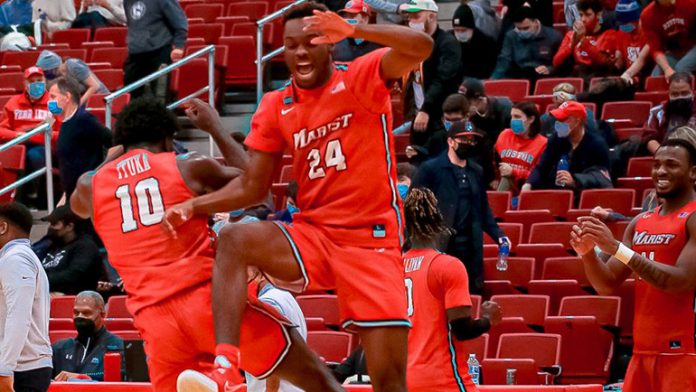 Jao Ituka and Braden Bell celebrate Marist’s win at BU as Victor Enoh looks on. Photo: Annabel Banks