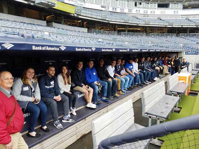 R. Scott Russell, assistant professor of Sports Management at the Mount, with Business students at Yankee Stadium. Photo provided.