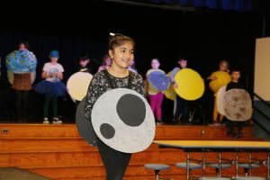 Grade 2 student Ami Barot dresses as the moon during Riccardi’s Planet Runway extravaganza. Photo: Kristine Conte/Ulster BOCES