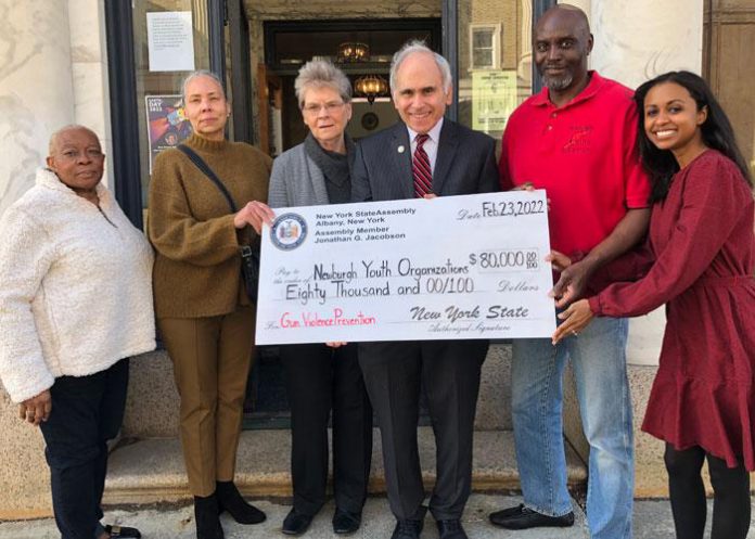 With youth gun violence in the cities of Newburgh and Poughkeepsie showing little signs of waning, the State Office of Children and Family Services has awarded programs in both cities a total of $145,000 for youth organizations. State Assemblyman Jonathan Jacobson pictured above (third from right) presents check.