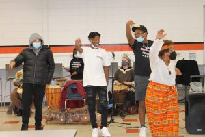 From left to right: Marlboro High School students Tash-mir Eggleston, Tamir Bass, and Isiah Fitchett dance along to the music played by their classmates and the Kofi and Sankofa Drum and Dance Ensemble at the Black History Jamboree, hosted by the Students Empowering Equality Club on February 28.