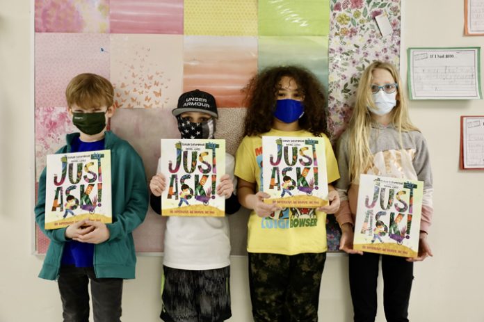 Marbletown Elementary School students received copies of the book “Just Ask” on February 22. Pictured (from left to right) are: Aidan O’Keefe, Alex Kozack, Yesenia Rios, and Caylynn Miles.