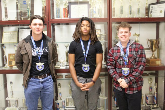 Ulster BOCES Aviation/Drone students Sean Sasso, Saugerties Central School District (l); Daiven Leath, Highland Central School District (center); and Connor Bruschi, Wallkill Central School District (r); proudly display the first place medals they won in the Federal Aviation Administration STEM Aviation and Space Education Airport Design Challenge. The trio was part of a team of five dubbed the “Straw Hat Pilots,” and competed against more than 3,000 students from 50 states and 18 different countries.