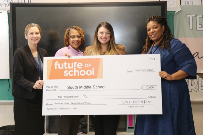 On Tuesday, March 22, 2022, representatives from Future of School presented Ms. Cruz with a check during a brief ceremony.