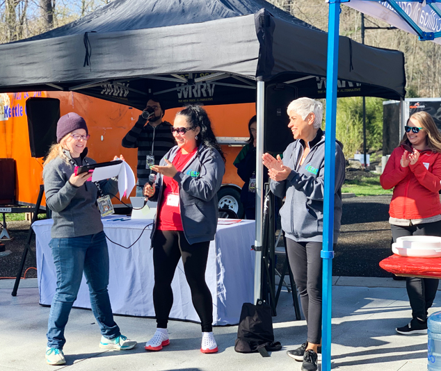 Melissa Hannigan of Ellenville Regional hospital and board member of the American Heart Association, (middle) and chief nursing officer at Ellenville Regional Hospital, Maria Gonzales (right), a survivor herself, deliver opening remarks to commence the Dutchess-Ulster Heart Walk last Saturday.