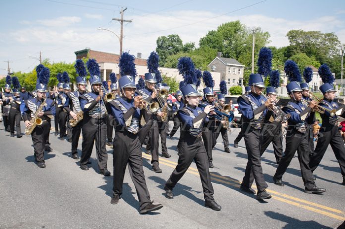 Hundreds of people gathered along Broadway in the City of Newburgh on Monday, May 30 to see the annual Memorial Day Parade which featured numerous floats and groups representing various organizations, such as the Newburgh Free Academy Marching Band, pictured, who paid tribute to those who sacrificed their all for the greater good. Hudson Valley Press/CHUCK STEWART, JR.